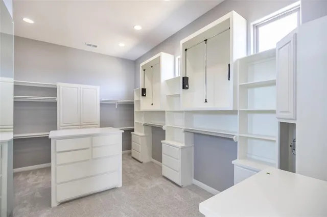 a kitchen with a refrigerator and sink