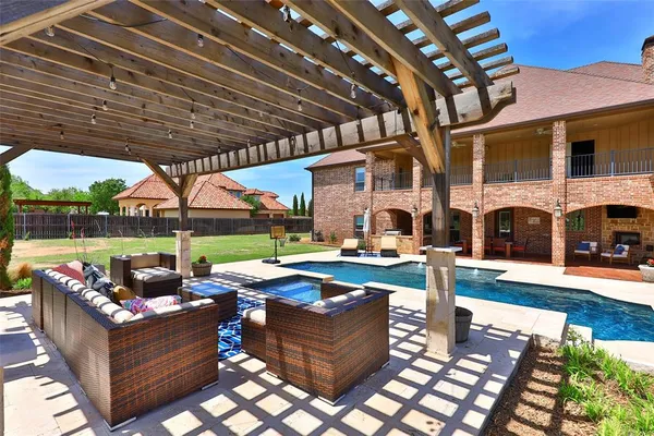a view of a patio with table and chairs potted plants with wooden floor