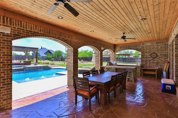 a view of a dining room with furniture window and outside view