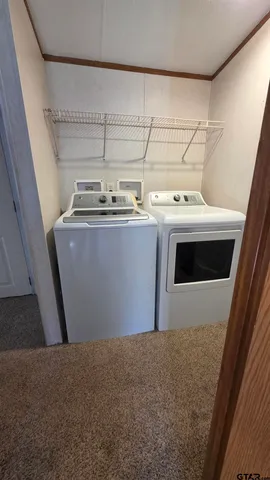 a view of storage and utility room with washer and dryer