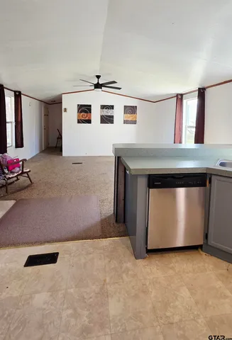 a view of an empty room with windows