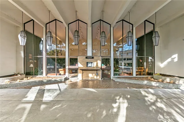 a view of a porch with a table and chairs