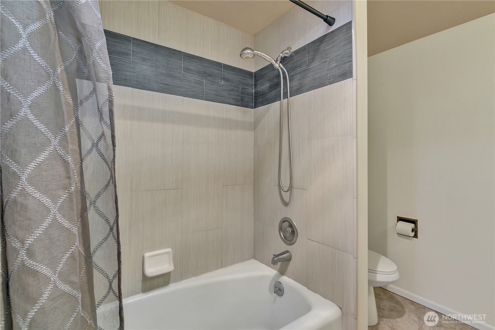 4545 Sand Point Way Northeast, Unit 207 Seattle, WA 98105 - Photo 21 of 25 a bathroom with a shower and a toilet