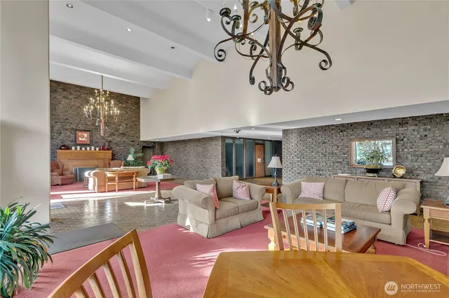 a living room with furniture or couch and a dining table