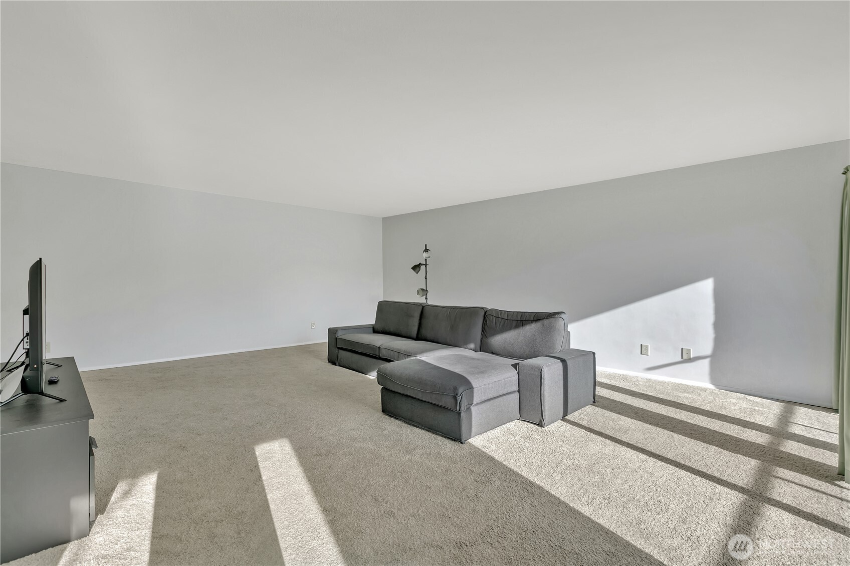 4545 Sand Point Way Northeast, Unit 207 Seattle, WA 98105 - Photo 8 of 25 a living room with furniture