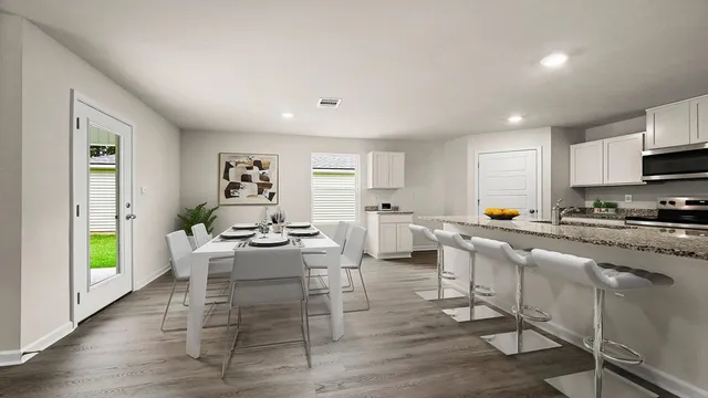 a living room with furniture wooden floor and a window