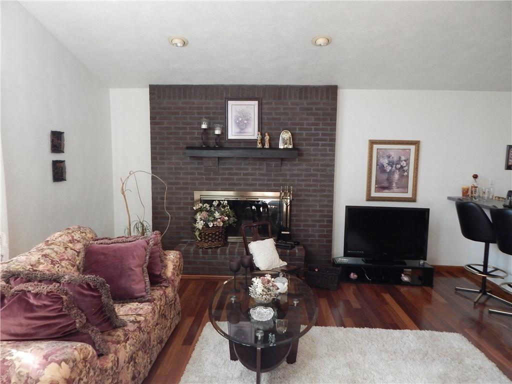 138 Salina Ext Road Avonmore, PA 15618 - Photo 3 of 24 FAMILY ROOM WITHGLEAMING HARDWOOD FLOORING.