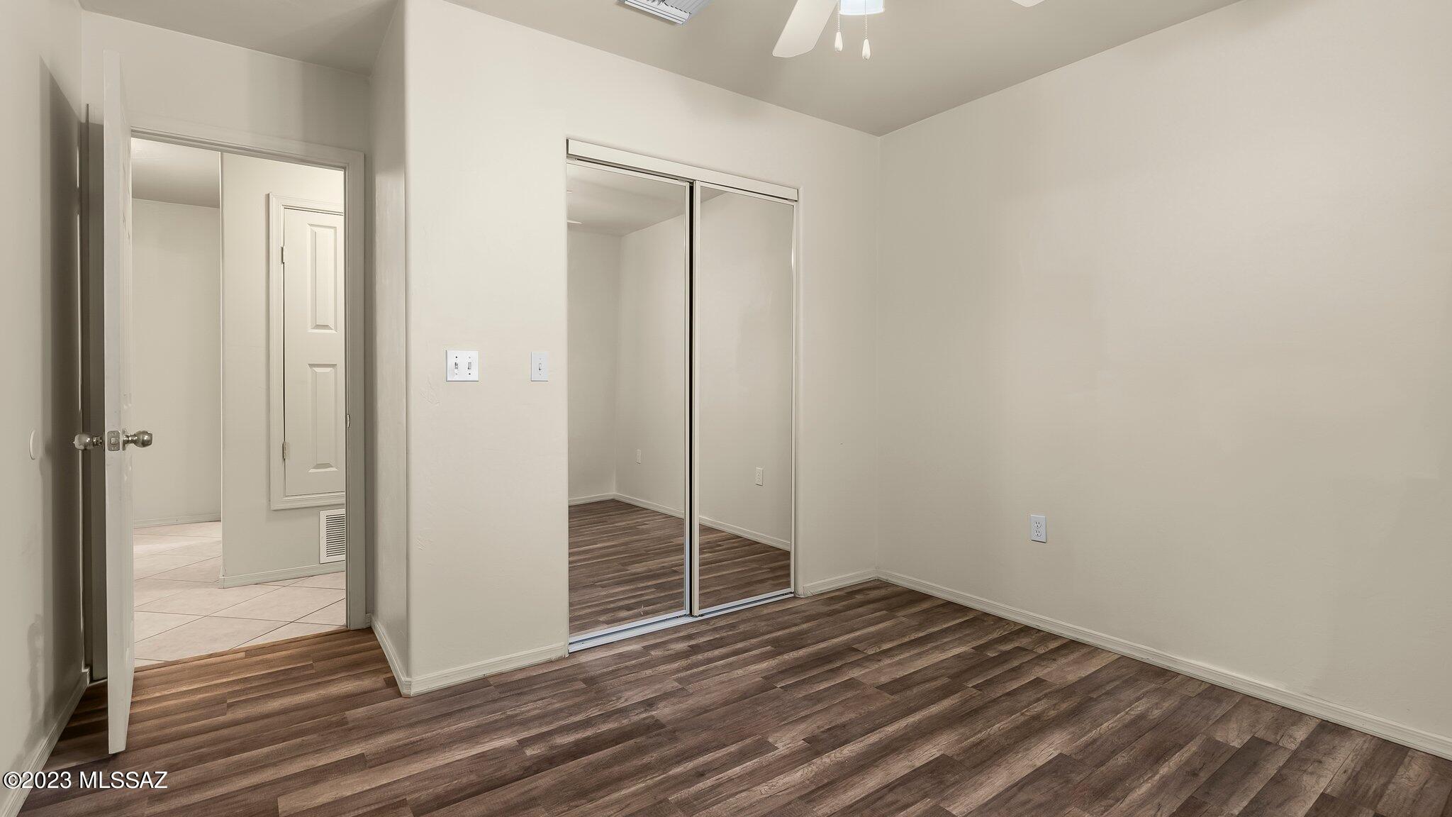 96 Calle Quintana Rio Rico, AZ 85648 - Photo 20 of 30 a view of a room with wooden floor and a bathroom