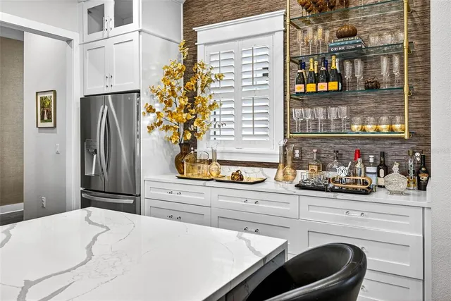 a bathroom with a granite countertop sink a vanity and mirror