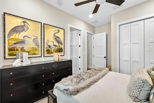 a view of a house with swimming pool and sitting area