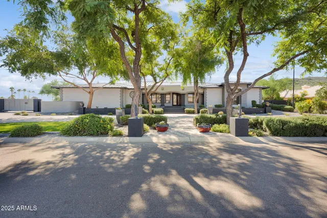 a kitchen with stainless steel appliances kitchen island granite countertop a sink and cabinets