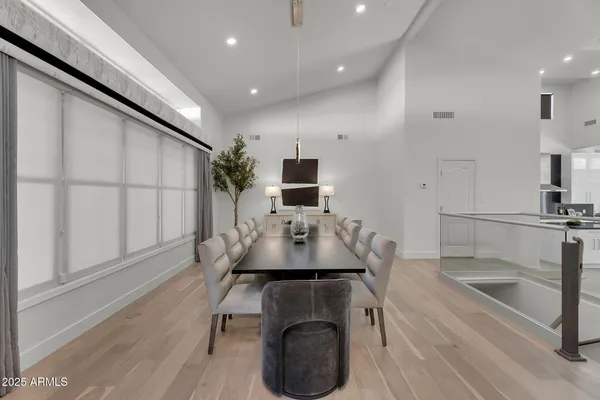 a large kitchen with stainless steel appliances granite countertop a sink a stove and a center island