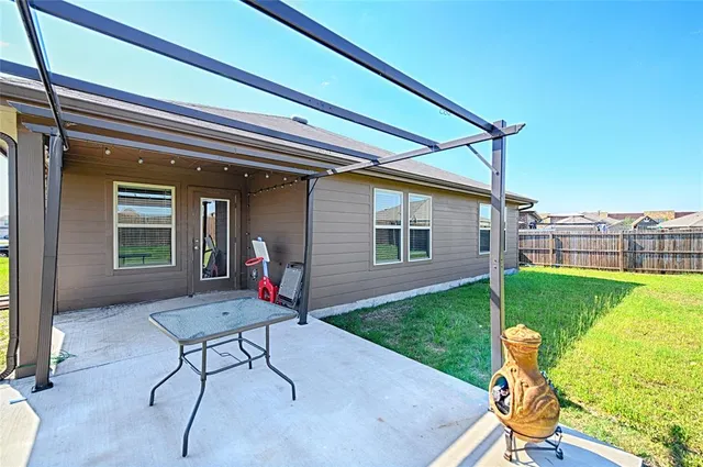 a backyard of a house with seating space
