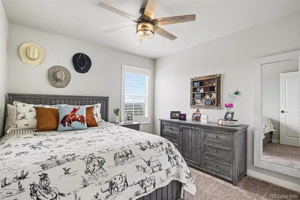 a bedroom with a bed and a dresser