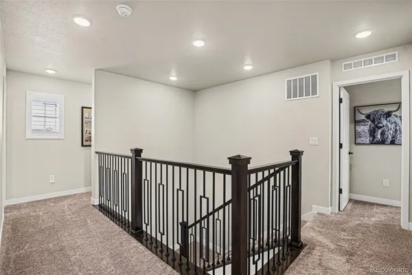 a view of a hallway with a window