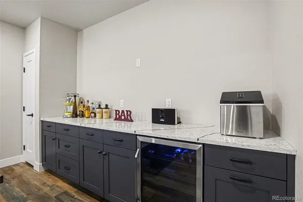 a kitchen with cabinets stainless steel appliances and a sink