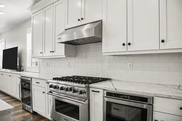 a kitchen with cabinets and appliances