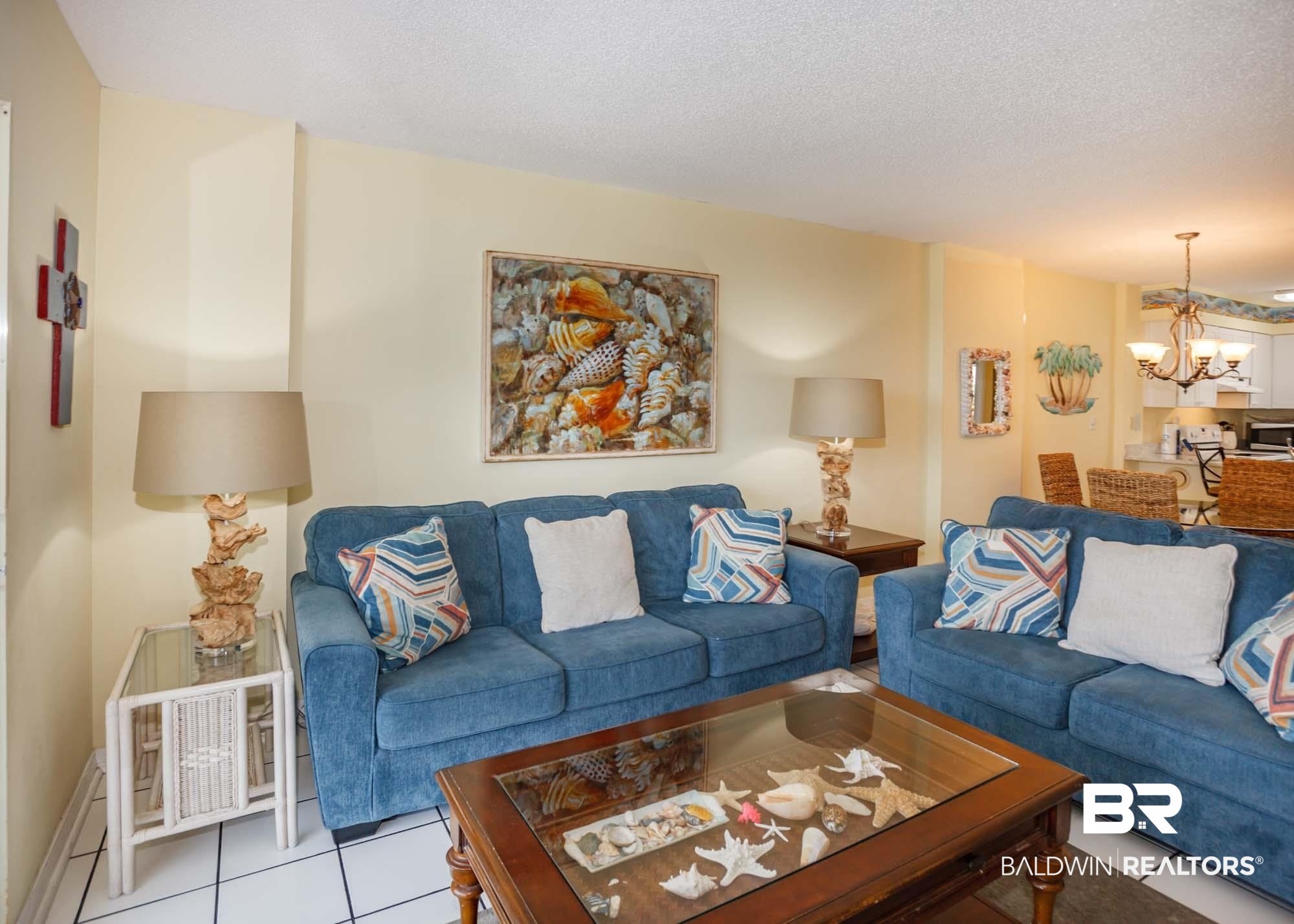 645 Plantation Road, Unit 6311 Gulf Shores, AL 36542 - Photo 33 of 43 Living area featuring a chandelier, tile patterned flooring, and a textured ceiling
