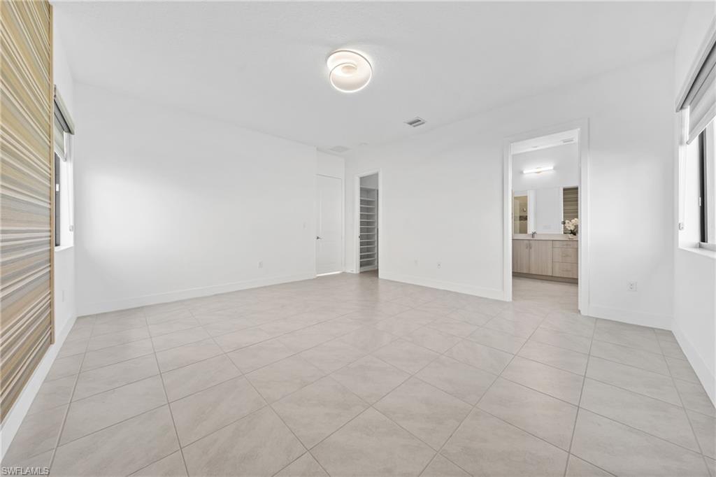 4947 Brigata Way Avenue Immokalee, FL 34142 - Photo 14 of 50 a view of an empty room with a window