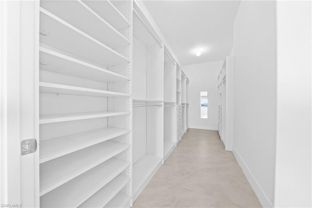 4947 Brigata Way Avenue Immokalee, FL 34142 - Photo 18 of 50 a view of a hallway with white walls