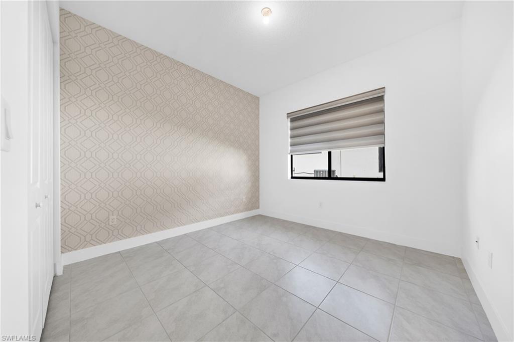 4947 Brigata Way Avenue Immokalee, FL 34142 - Photo 19 of 50 an empty room with windows and closet