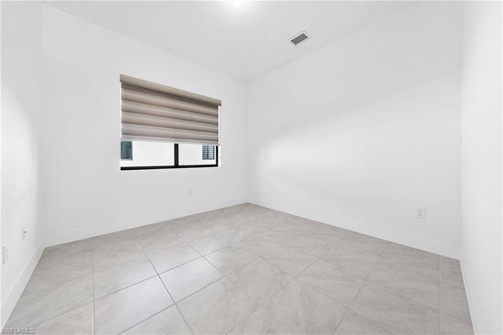 4947 Brigata Way Avenue Immokalee, FL 34142 - Photo 21 of 50 an empty room with a window