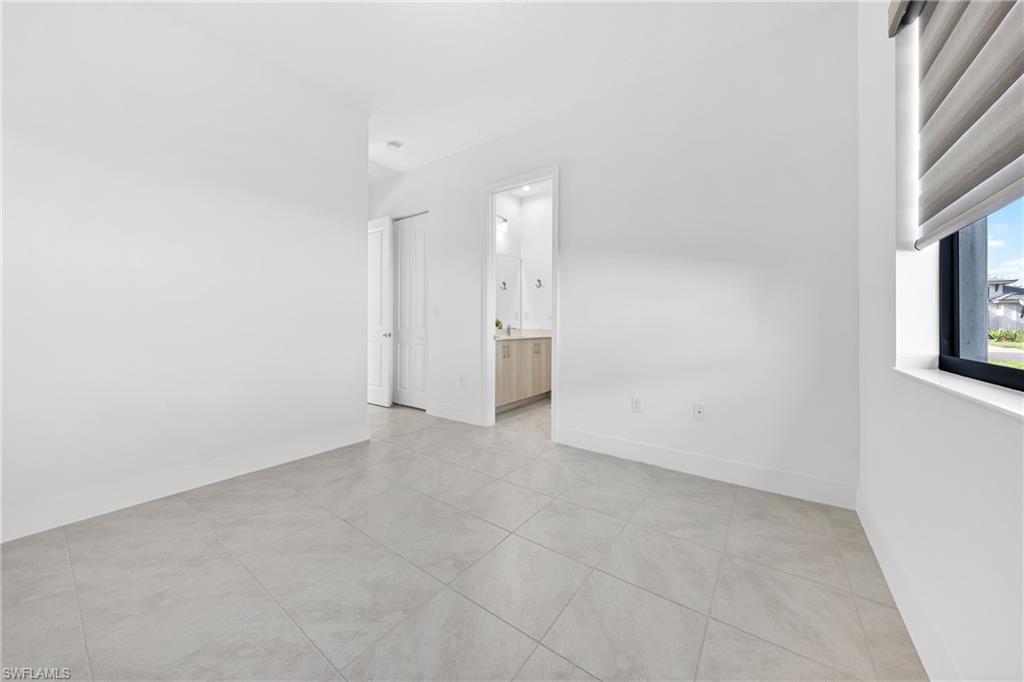 4947 Brigata Way Avenue Immokalee, FL 34142 - Photo 22 of 50 a view of an empty room with a window