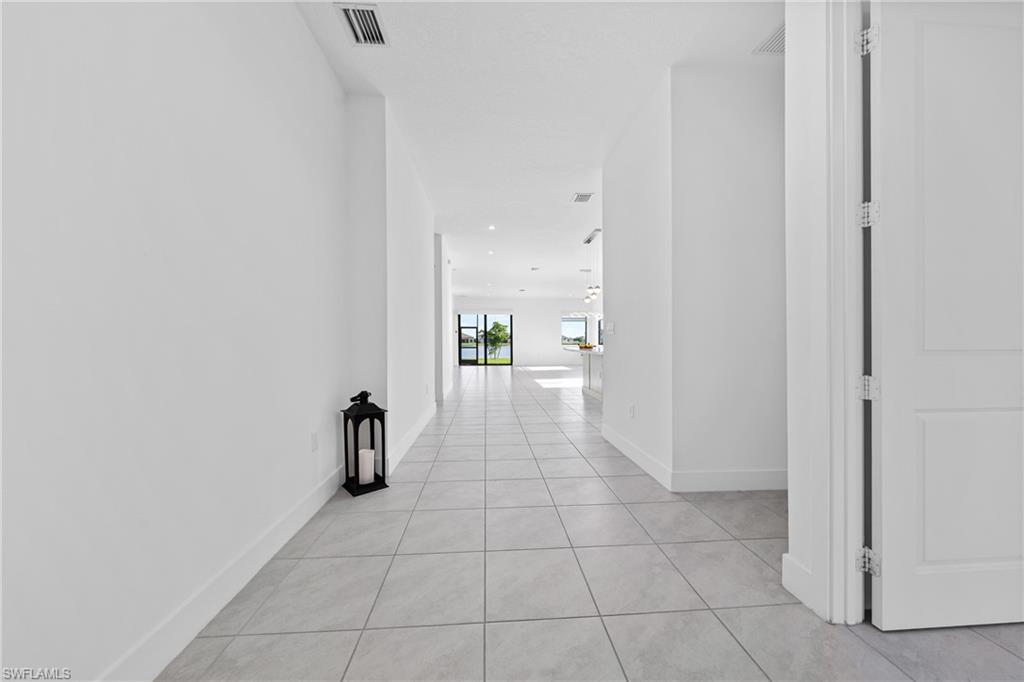 4947 Brigata Way Avenue Immokalee, FL 34142 - Photo 26 of 50 a hallway with a black white checkered floor