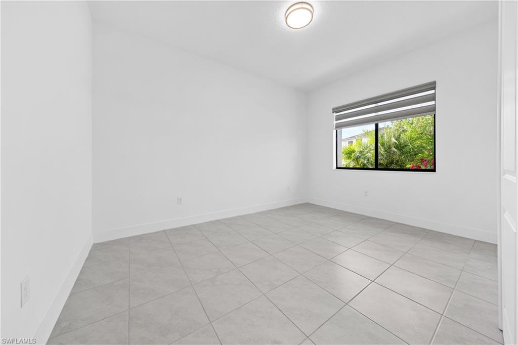 4947 Brigata Way Avenue Immokalee, FL 34142 - Photo 27 of 50 an empty room with windows
