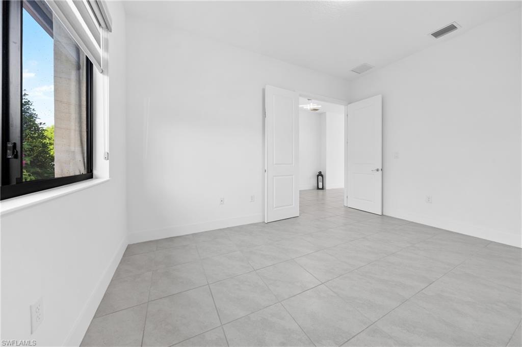 4947 Brigata Way Avenue Immokalee, FL 34142 - Photo 28 of 50 a view of an empty room with a window