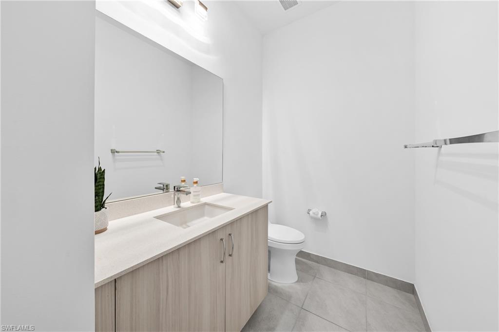 4947 Brigata Way Avenue Immokalee, FL 34142 - Photo 29 of 50 a bathroom with a sink and a mirror