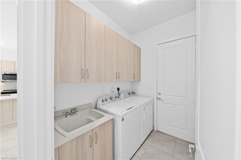 4947 Brigata Way Avenue Immokalee, FL 34142 - Photo 30 of 50 a bathroom with a sink and a toilet