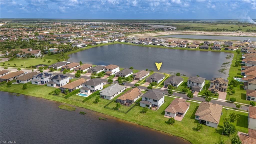 4947 Brigata Way Avenue Immokalee, FL 34142 - Photo 35 of 50 an aerial view of a house with a lake view