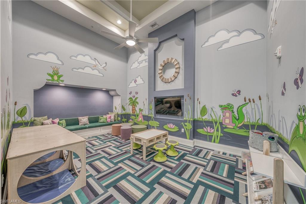 4947 Brigata Way Avenue Immokalee, FL 34142 - Photo 42 of 50 a living room filled with furniture and a flat screen tv