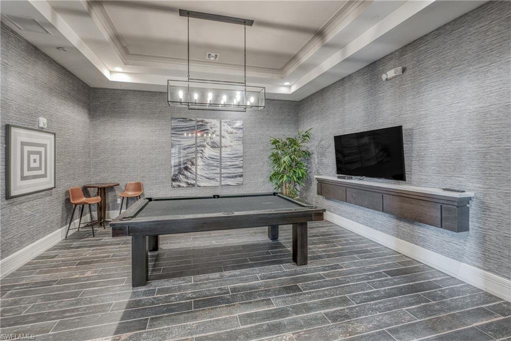 4947 Brigata Way Avenue Immokalee, FL 34142 - Photo 46 of 50 a living room with patio furniture and a flat screen tv