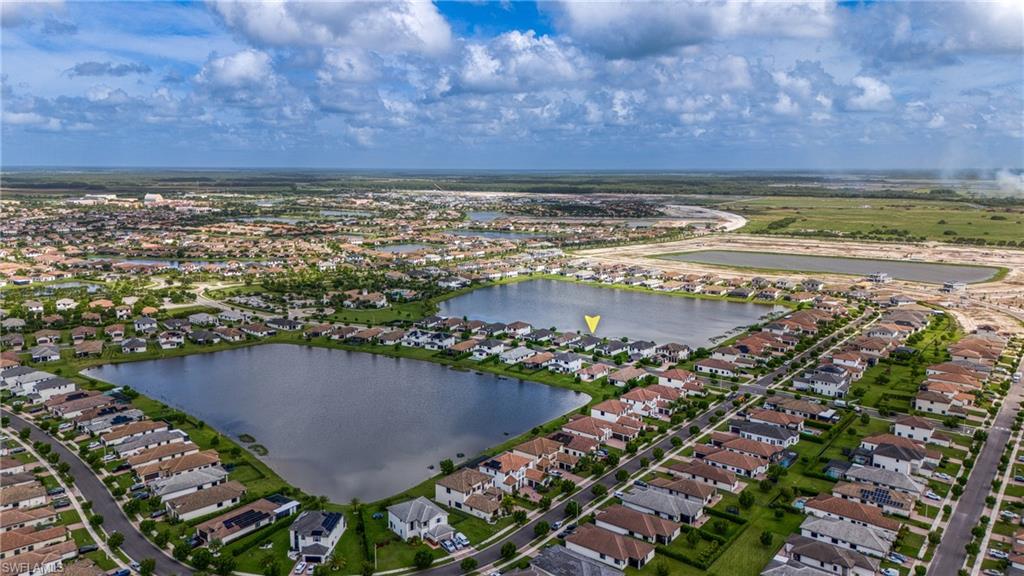 4947 Brigata Way Avenue Immokalee, FL 34142 - Photo 49 of 50 a view of a lake with a outdoor space