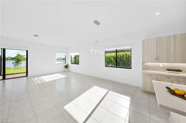 a view of a kitchen with a sink and a stove top oven