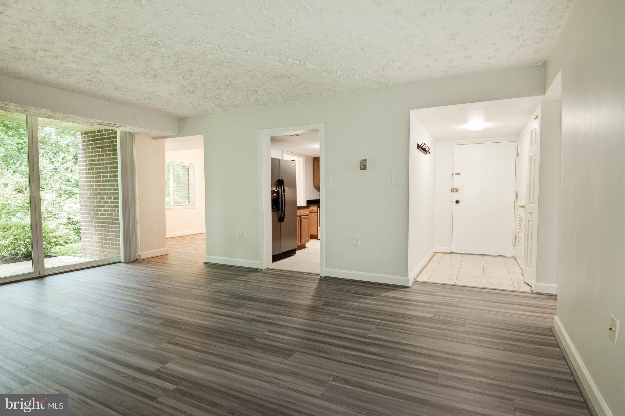 1411 Northgate Square, Unit 14111B Reston, VA 20190 - Photo 11 of 39 Foyer opens to living area