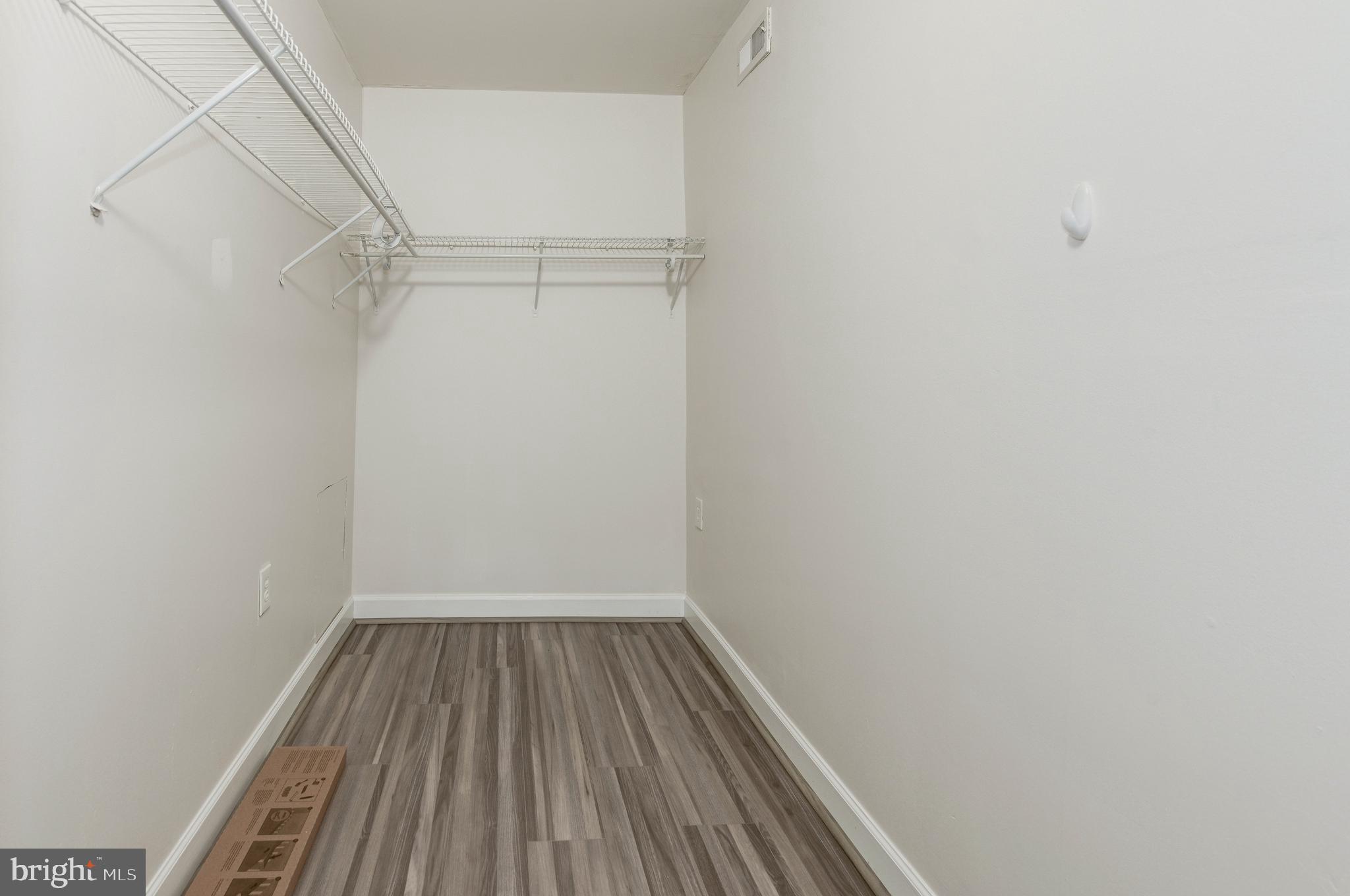 1411 Northgate Square, Unit 14111B Reston, VA 20190 - Photo 25 of 39 Primary bedroom; bedroom 1 of 2; walk-in closet