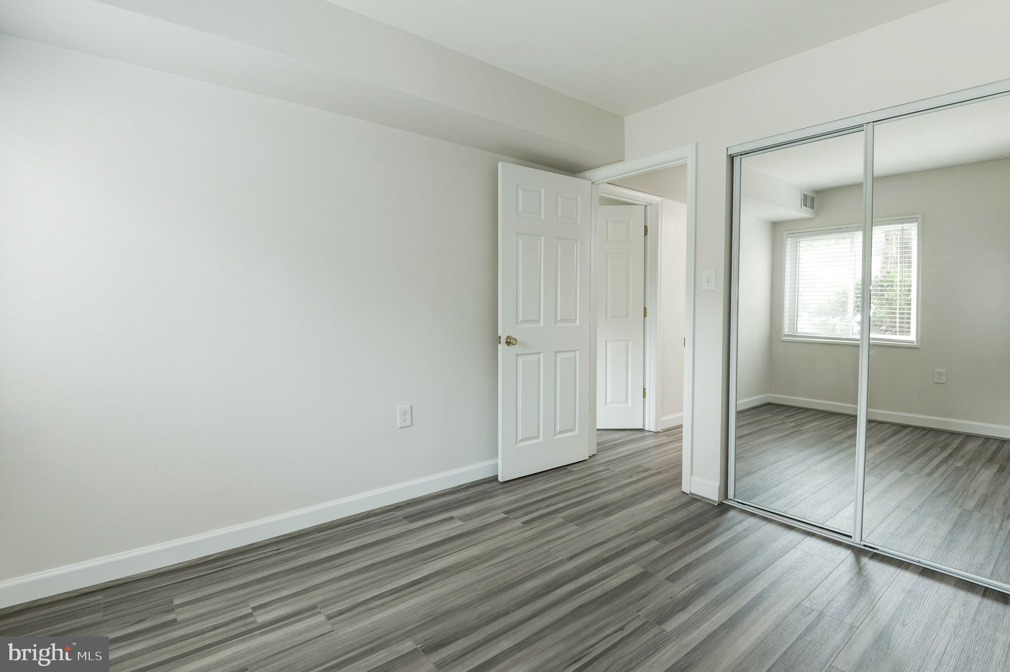 1411 Northgate Square, Unit 14111B Reston, VA 20190 - Photo 29 of 39 Hall bedroom; bedroom 2 of 2