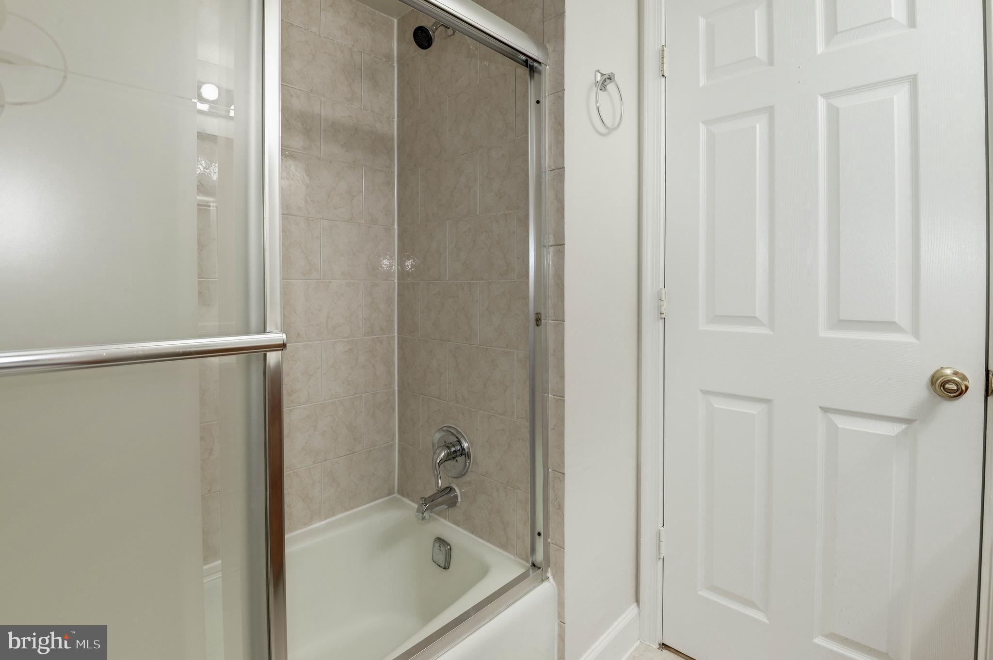 1411 Northgate Square, Unit 14111B Reston, VA 20190 - Photo 33 of 39 Hall bath; bath 2 of 2; enclosed tub w/shower