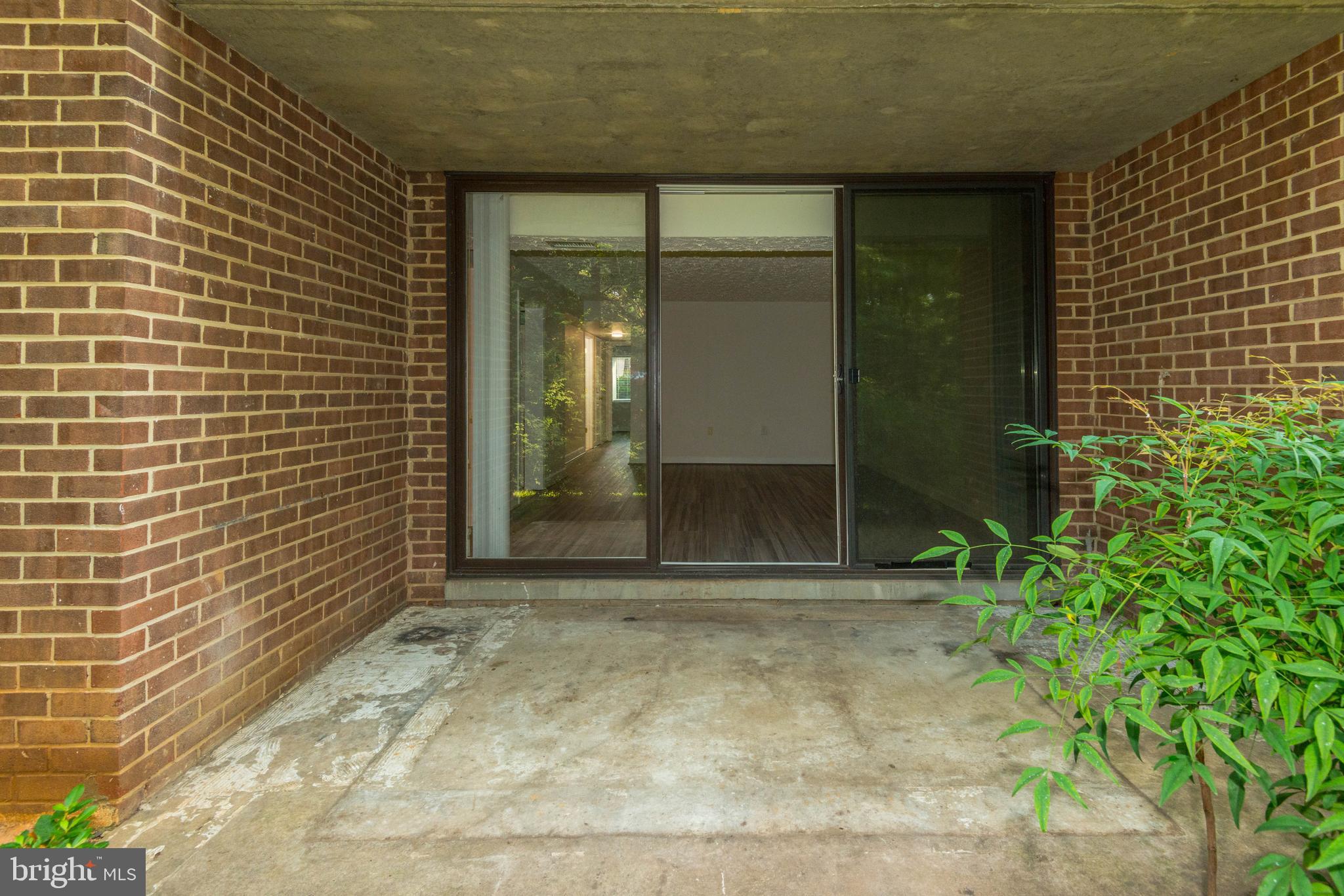 1411 Northgate Square, Unit 14111B Reston, VA 20190 - Photo 5 of 39 112 SQ. FT., patio area off of the living area