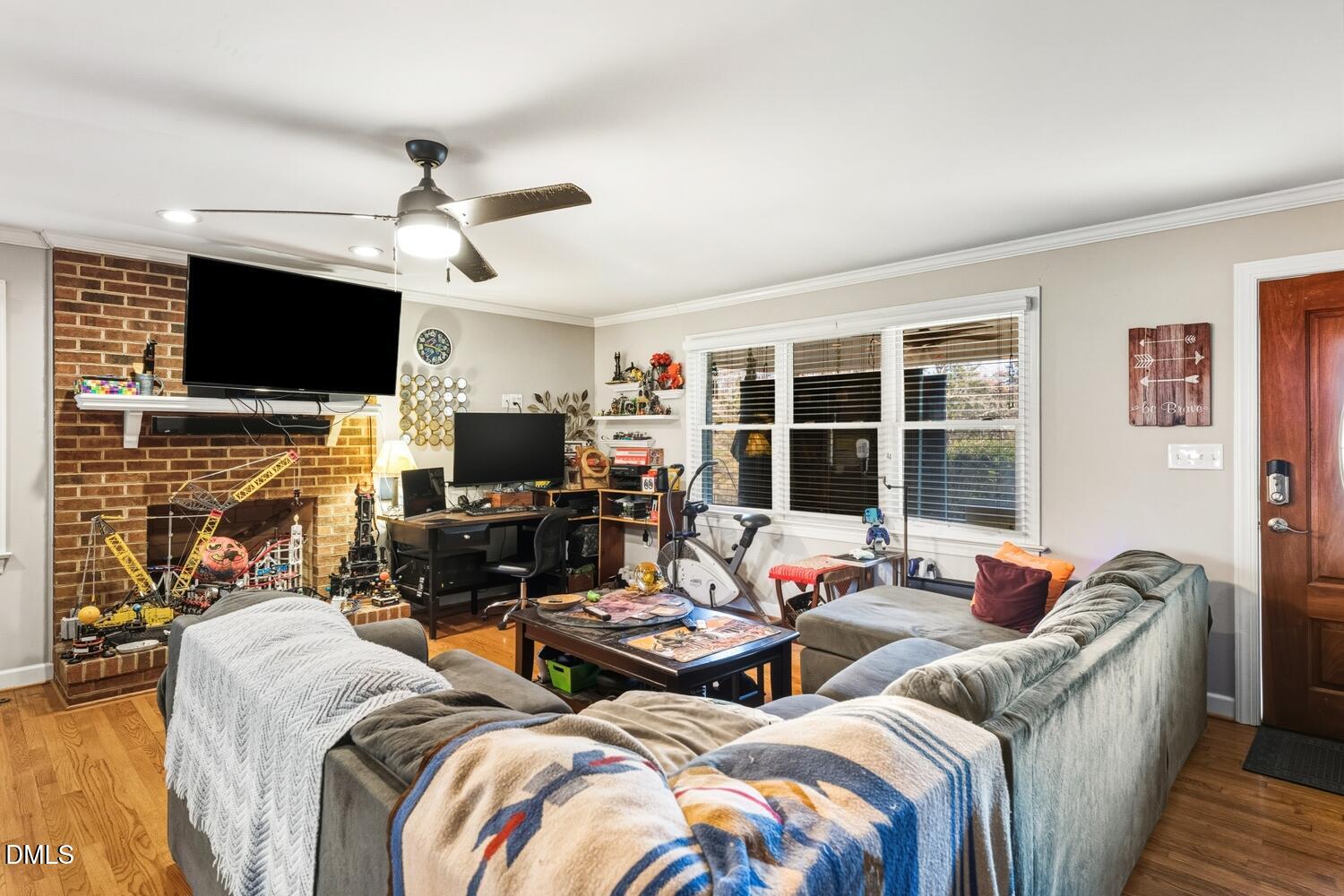 2961 Wormranch Road Haw River, NC 27258 - Photo 11 of 27 a living room with fireplace furniture and a flat screen tv