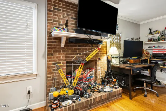 a dining room with furniture and wooden floor