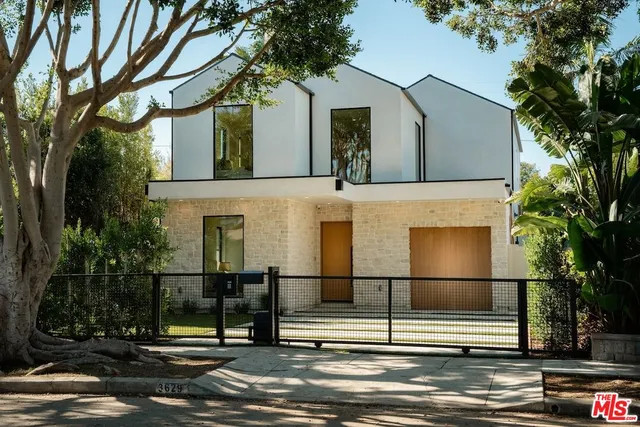 a front view of a house with a street