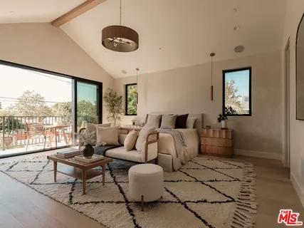 a bathroom with a double vanity sink a toilet and a mirror