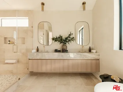 a balcony with table and chairs