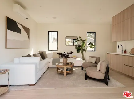 a view of a patio with table and chairs and potted plants