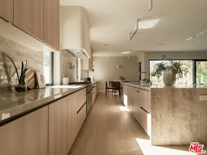 a living room with furniture a dining table and chairs