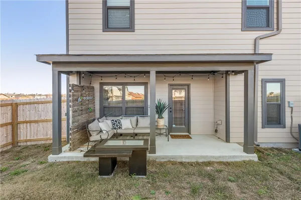 a front view of a house with outdoor seating